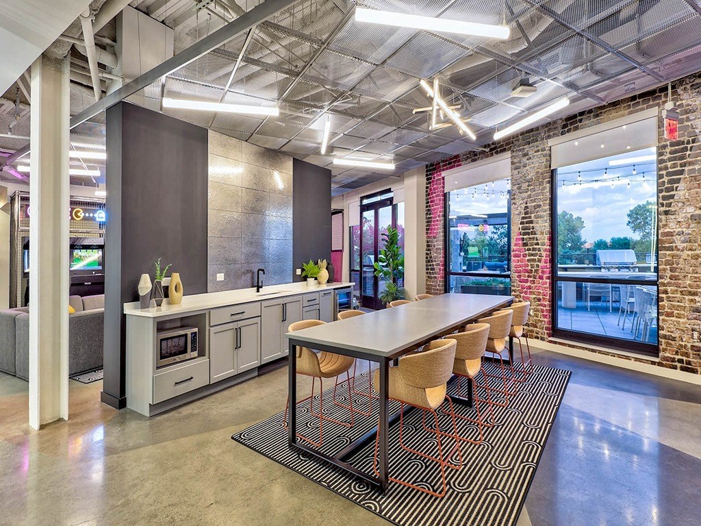 an open office space with a table and chairs